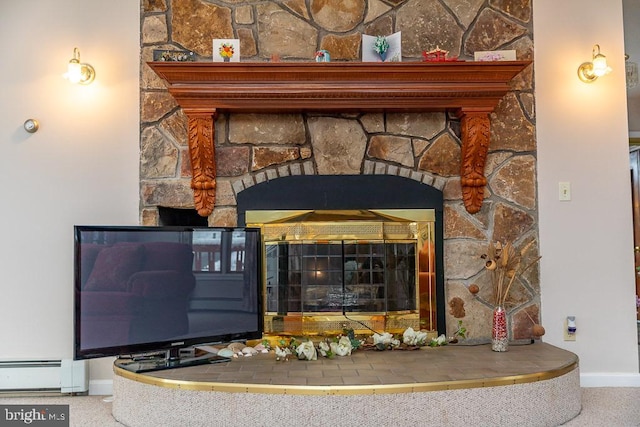 interior details featuring baseboard heating and a fireplace