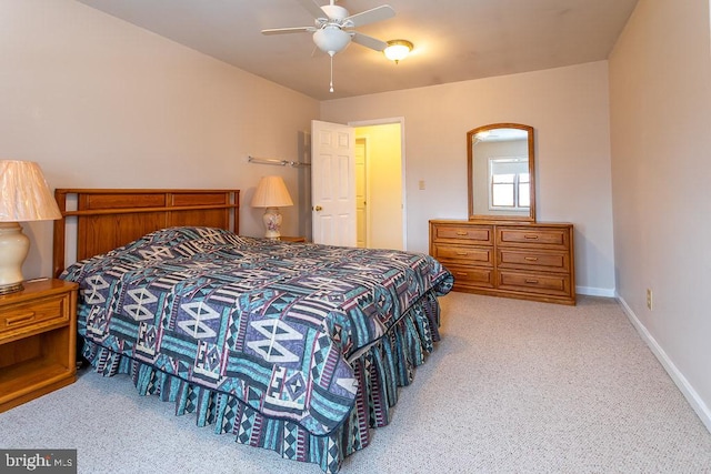 bedroom with light carpet and ceiling fan