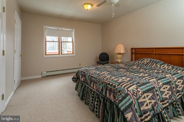 bedroom with baseboard heating, light carpet, and ceiling fan