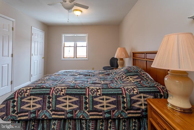 carpeted bedroom with ceiling fan