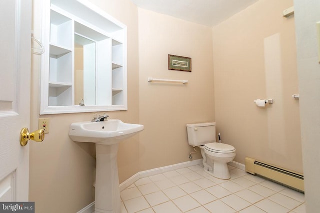 bathroom with sink, toilet, a baseboard radiator, and tile patterned flooring