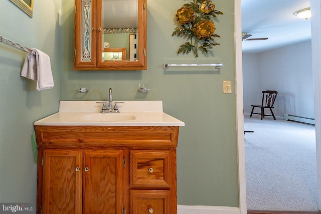 bathroom with vanity and a baseboard radiator