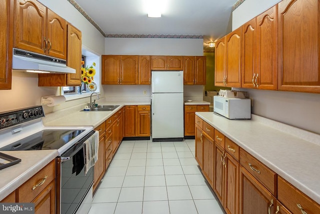 kitchen with white appliances, light tile patterned floors, and sink