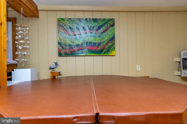 interior space featuring wooden walls and heating unit