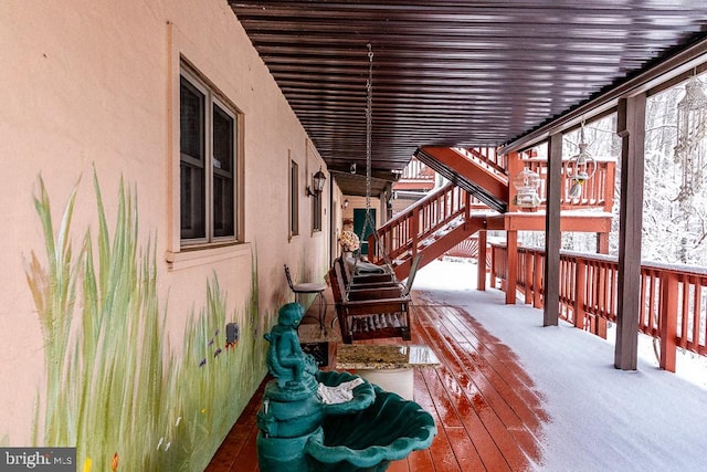 view of snow covered deck