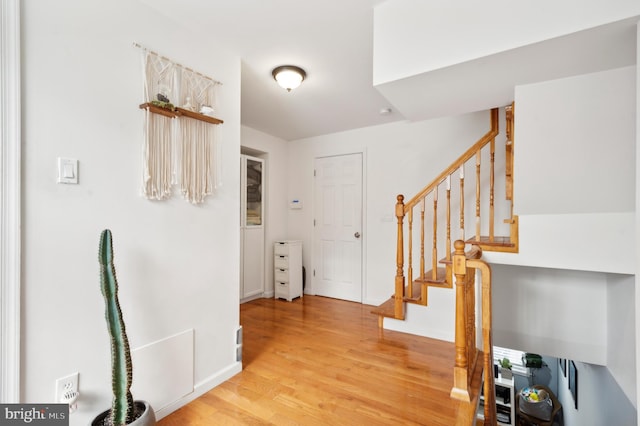 entryway with light hardwood / wood-style floors