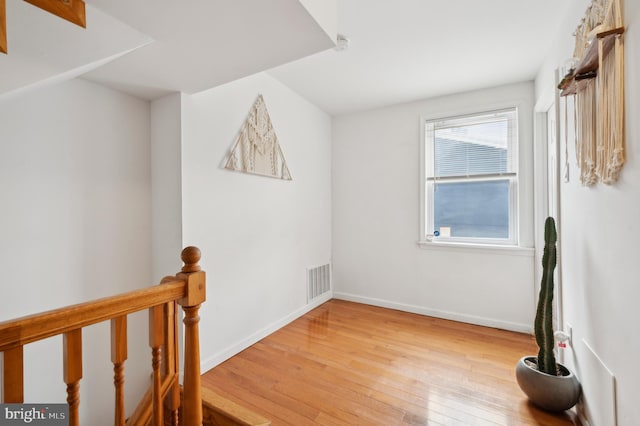 empty room with hardwood / wood-style floors