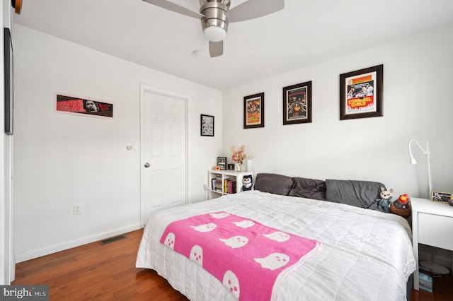 bedroom with ceiling fan and hardwood / wood-style flooring