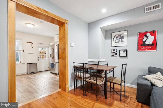 dining room with light hardwood / wood-style floors