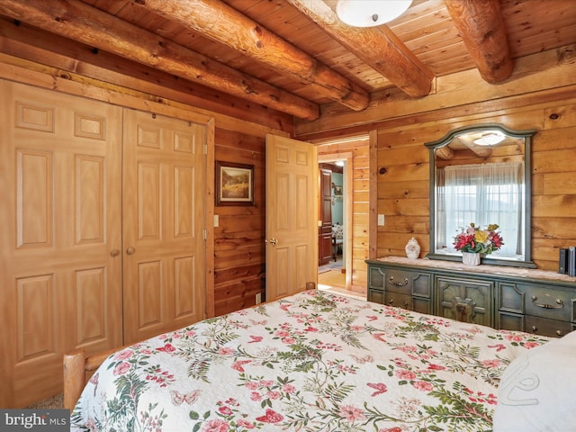 bedroom with wooden walls, beamed ceiling, and wood ceiling