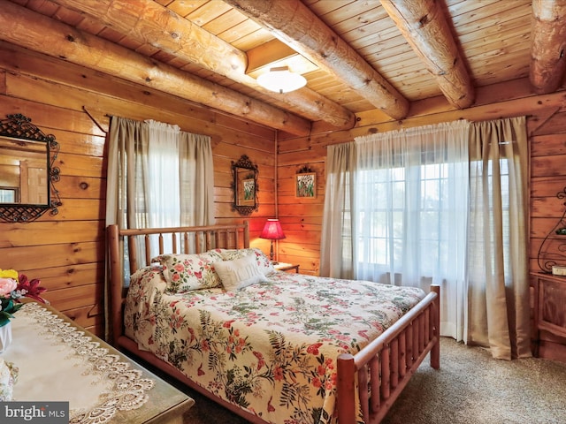 carpeted bedroom featuring beam ceiling, wood walls, and wood ceiling