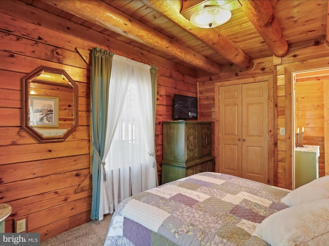 carpeted bedroom featuring beam ceiling, wood walls, and wooden ceiling