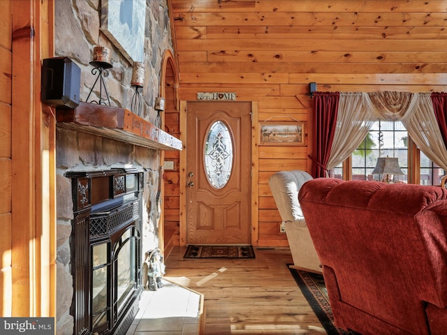 entryway featuring wood walls and wood-type flooring