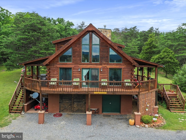 rear view of property with a patio area and a deck