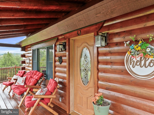 doorway to property with a porch