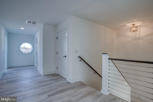 staircase with wood-type flooring