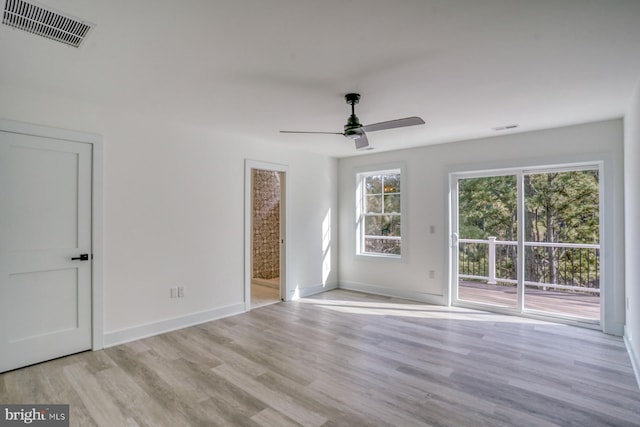 unfurnished room featuring light hardwood / wood-style flooring and ceiling fan