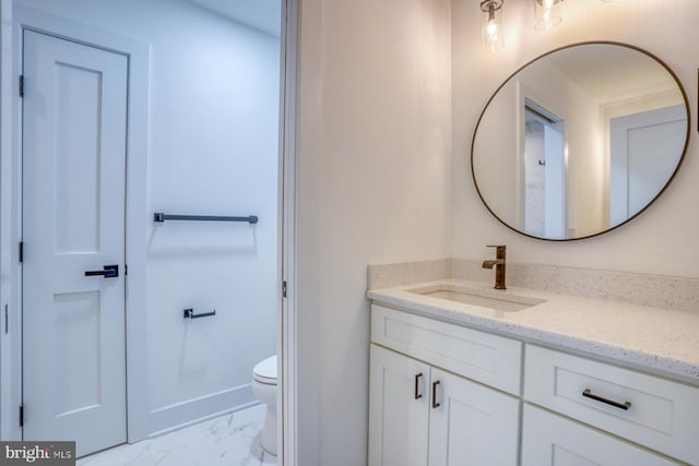 bathroom with toilet and vanity