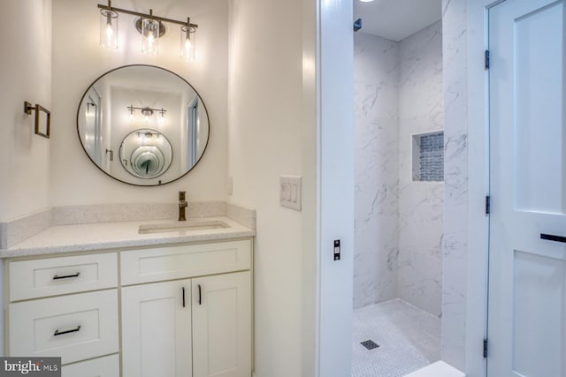 bathroom featuring vanity and a tile shower