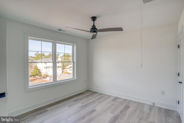 spare room with ceiling fan and light hardwood / wood-style floors