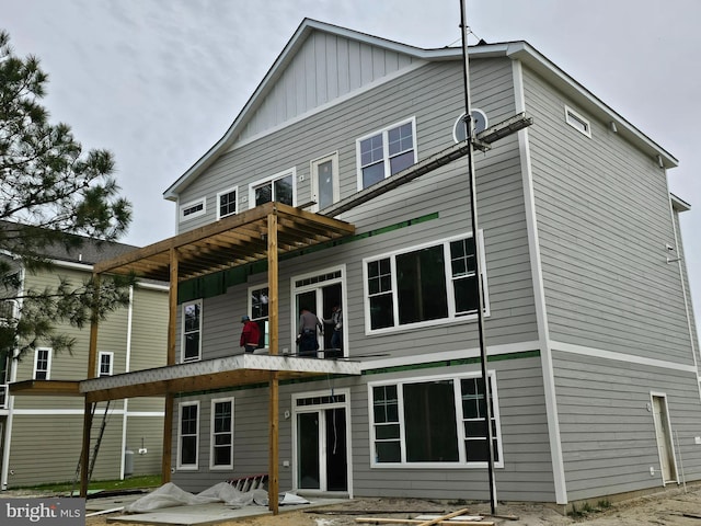 back of house with a patio