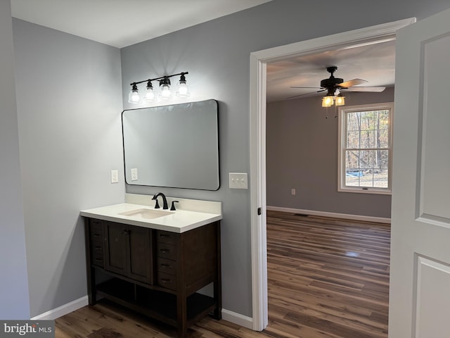 bathroom with vanity, wood-type flooring, and ceiling fan