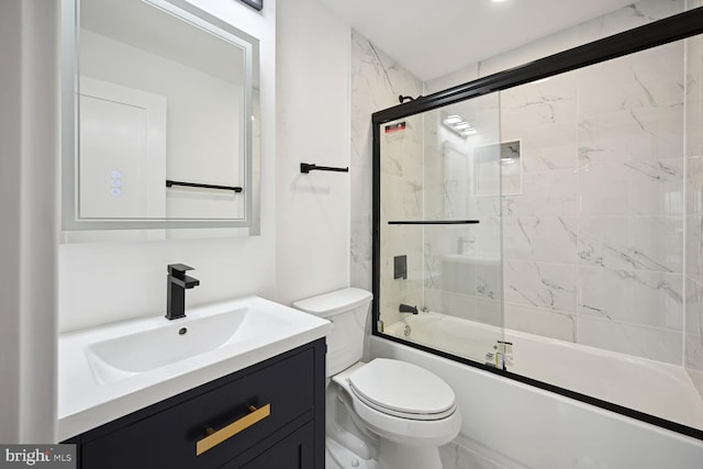 full bathroom with shower / bath combination with glass door, toilet, and large vanity