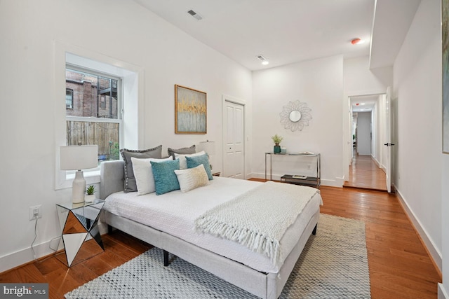 bedroom featuring a closet and light hardwood / wood-style floors