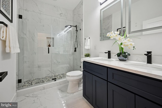 bathroom with tile flooring, a shower with door, toilet, and double vanity