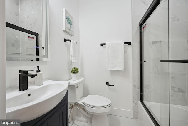 full bathroom with vanity, toilet, enclosed tub / shower combo, and tile floors