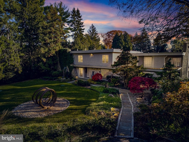 view of front of property with a lawn