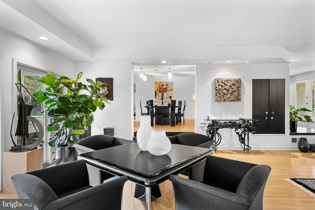 dining area with light hardwood / wood-style flooring