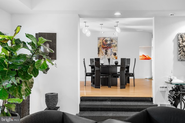 dining space with hardwood / wood-style floors