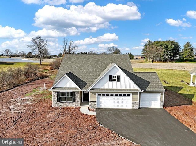 view of front facade featuring a garage and a front lawn