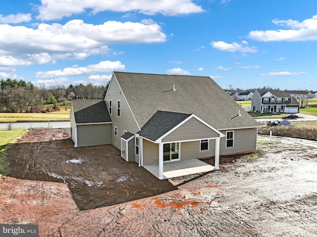 view of side of property featuring a patio area