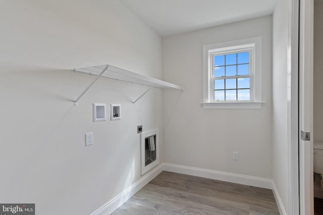 laundry room with hookup for an electric dryer, hookup for a washing machine, and hardwood / wood-style flooring