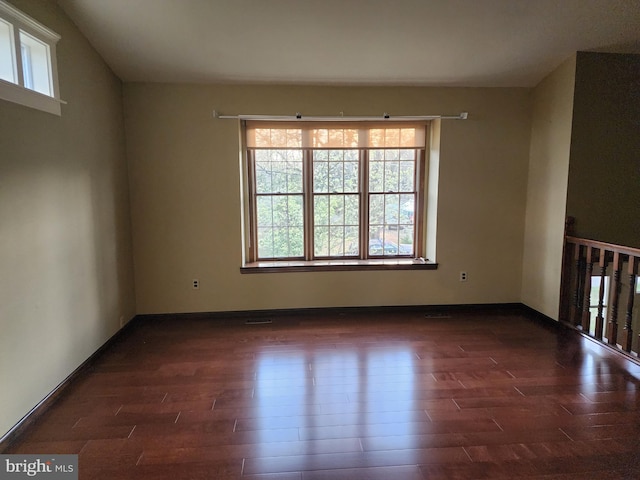 spare room featuring dark hardwood / wood-style floors