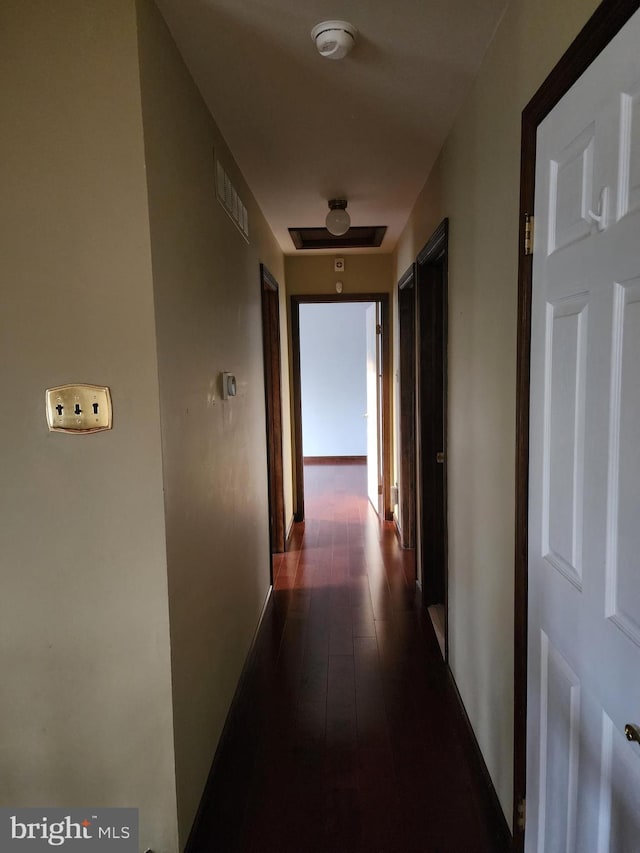 hall with dark hardwood / wood-style flooring