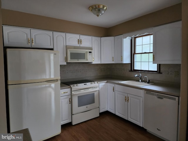 kitchen featuring white cabinets, white appliances, dark wood-type flooring, and sink