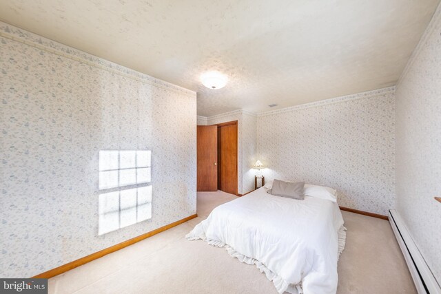 bedroom featuring a baseboard radiator, carpet flooring, and wallpapered walls