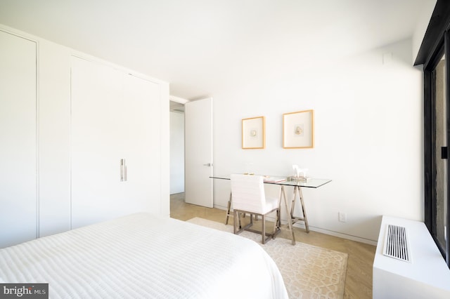 bedroom featuring light hardwood / wood-style floors