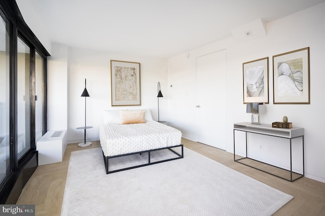 bedroom with light hardwood / wood-style flooring