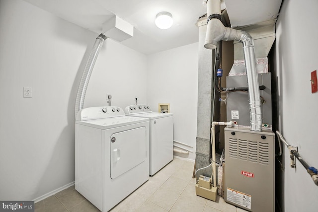 laundry area with independent washer and dryer, washer hookup, and light tile flooring