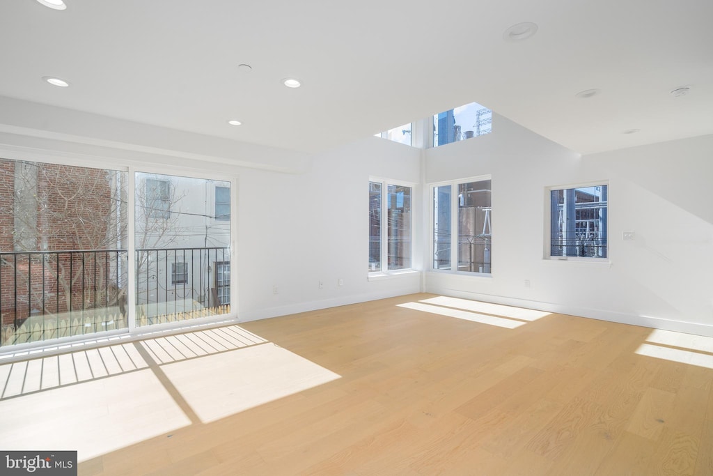 unfurnished room with light wood-type flooring