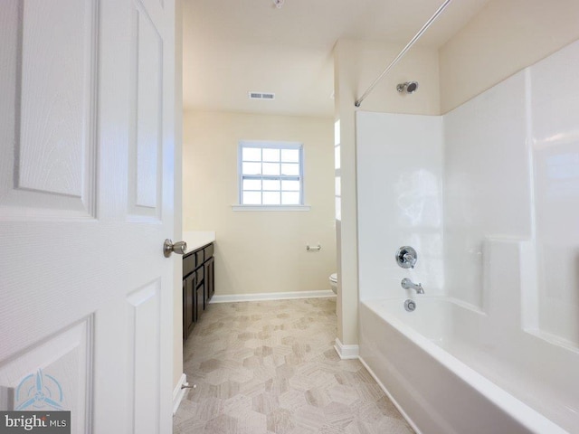 full bathroom with shower / bath combination, vanity, toilet, and tile flooring