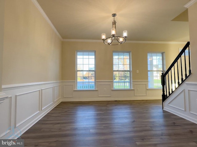 interior space featuring ornamental molding, an inviting chandelier, and dark hardwood / wood-style floors