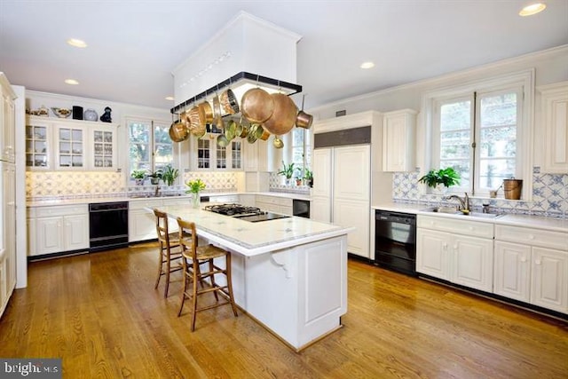 kitchen featuring plenty of natural light, tasteful backsplash, and a kitchen island