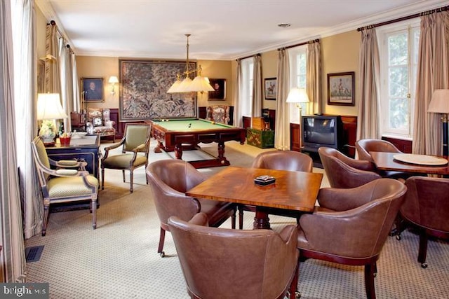 dining room with ornamental molding, light colored carpet, and pool table