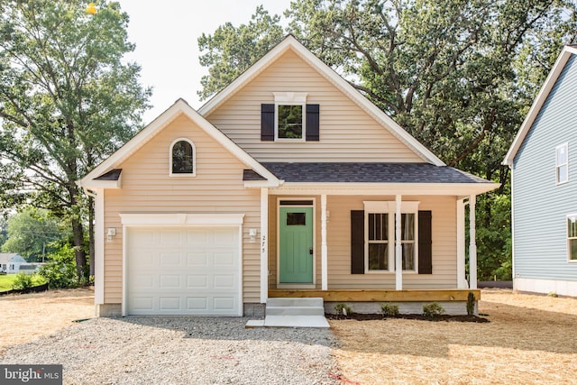 view of front facade with a garage and a porch