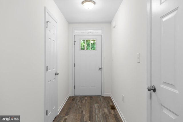 entryway with dark hardwood / wood-style floors